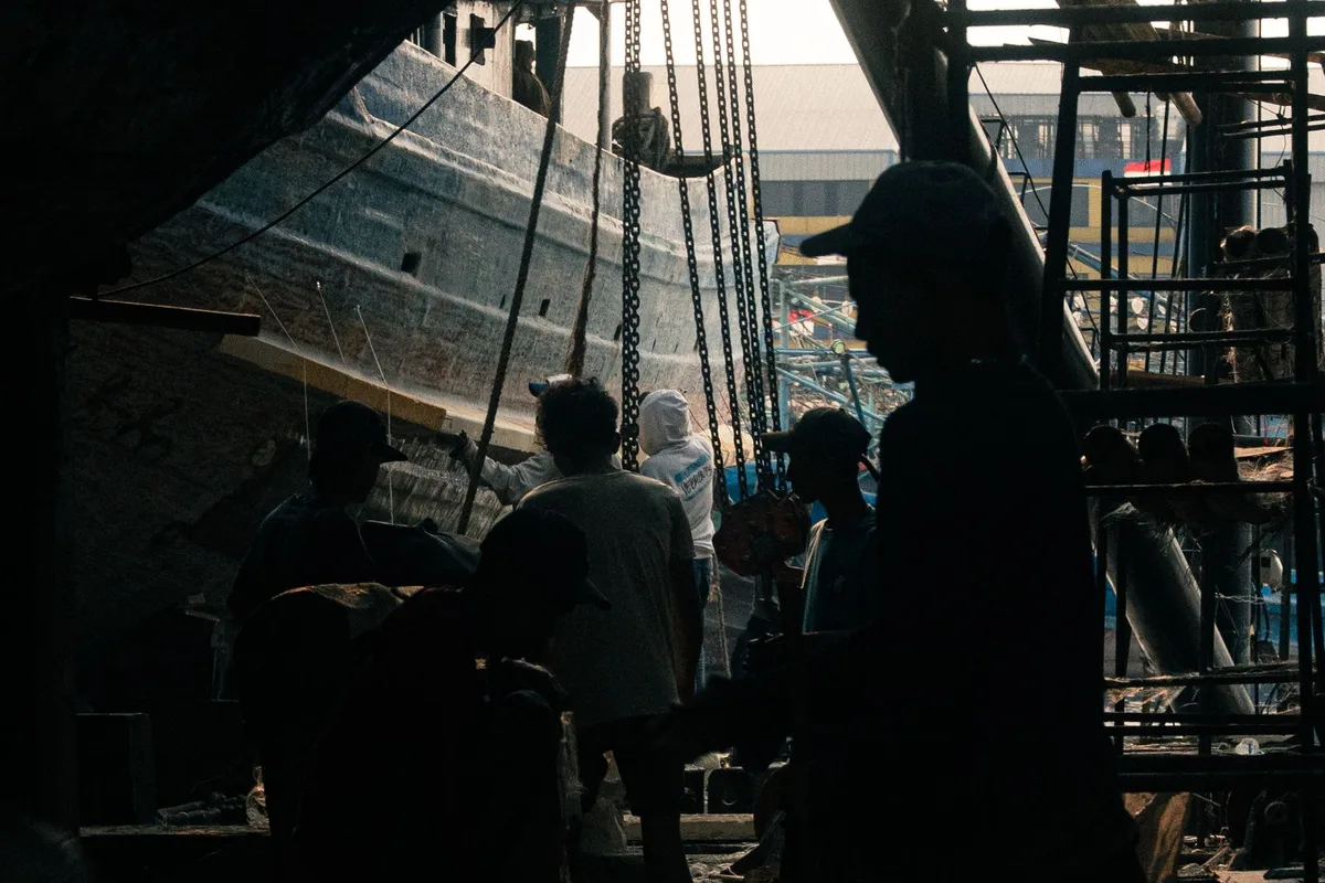 Shipyard workers building a vessel at an Indian shipyard.